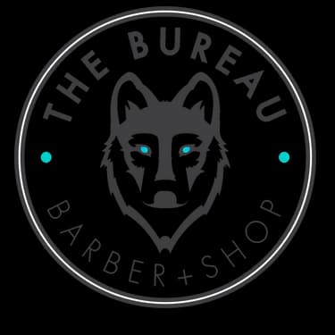 The Bureau Barber Shop wolf logo — circular emblem with wolf illustration and teal accents